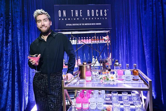 Instagram post by @lancebass for On The Rocks Premium Cocktails. Caption reads: Another @AMAs memory for the books! It was so....