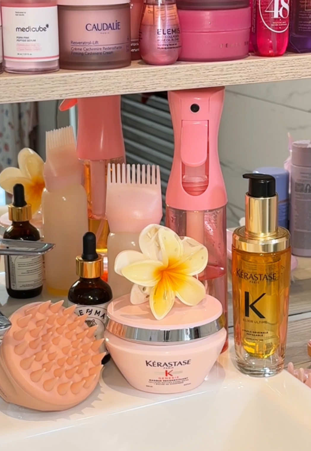 TikTok post by @by.emmaleah for Emi Jay. Caption reads: [...] shower nights >> ☁️🦋🩵🌙 products @Emi Jay....