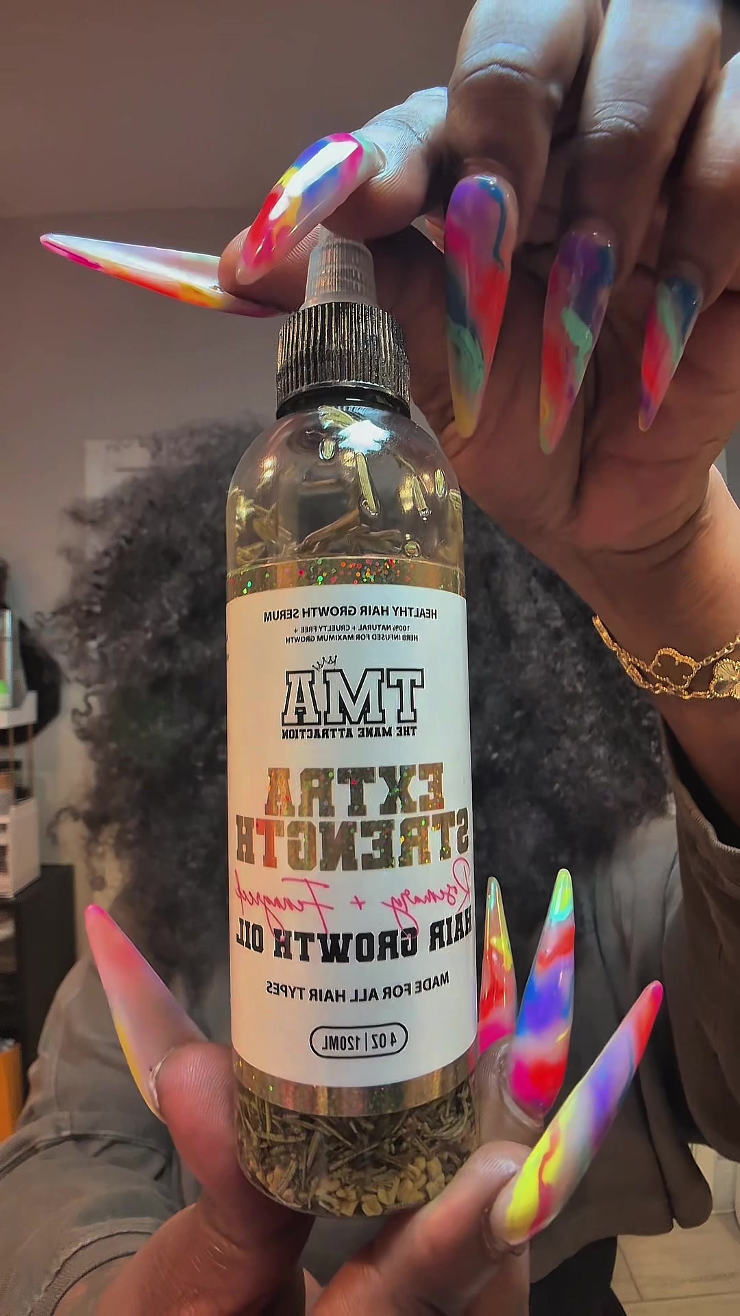 TikTok post by @iamafricanbomboda for The Mane Attraction. Caption reads: [...] is literally thriving 🌿 I added @The Mane....