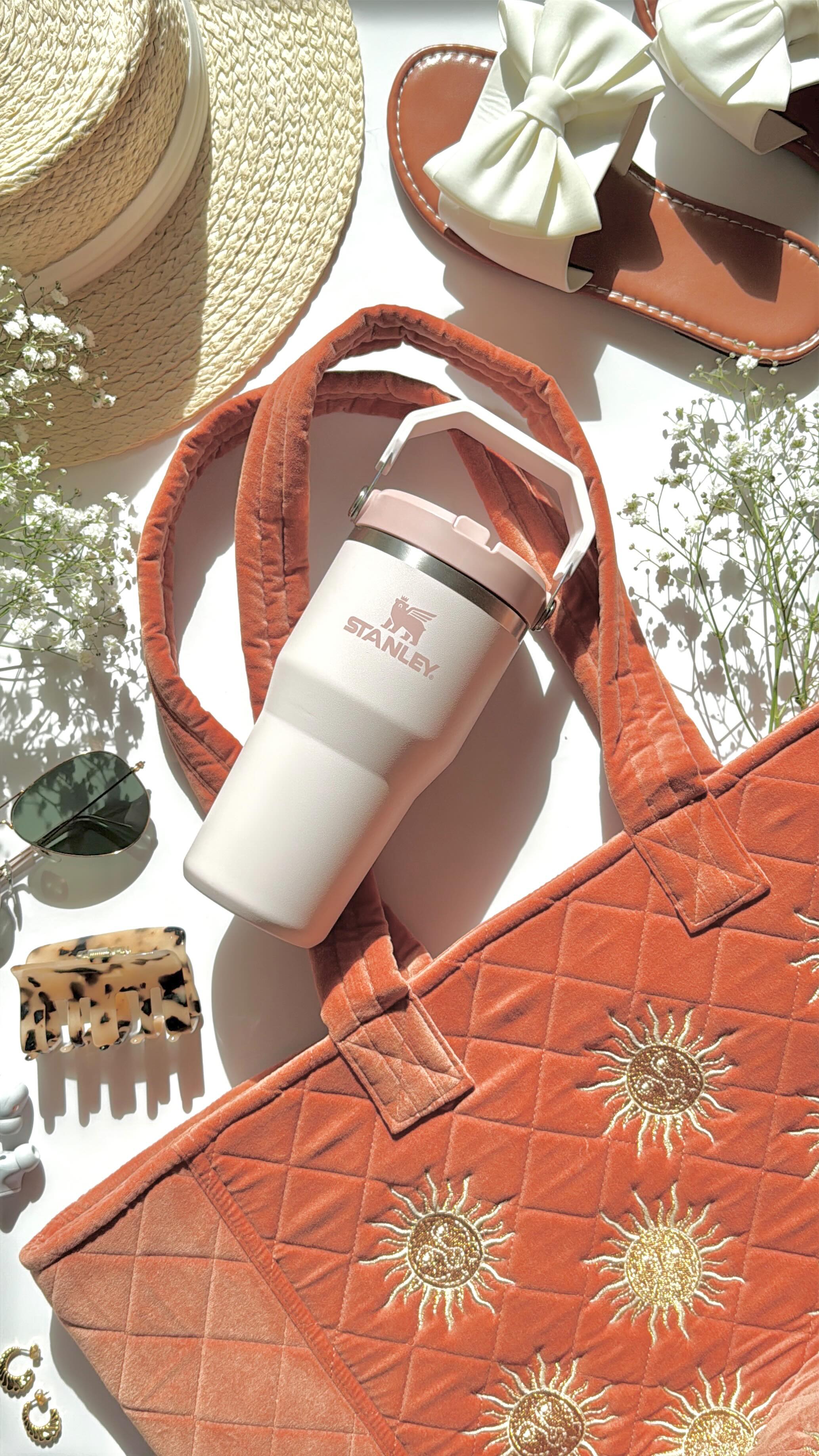 Instagram post by @cinmi.does.makeup for Stanley 1913. Caption reads: ☀️ AD || WHAT’S IN MY BAG ☀️

It is getting a bit....