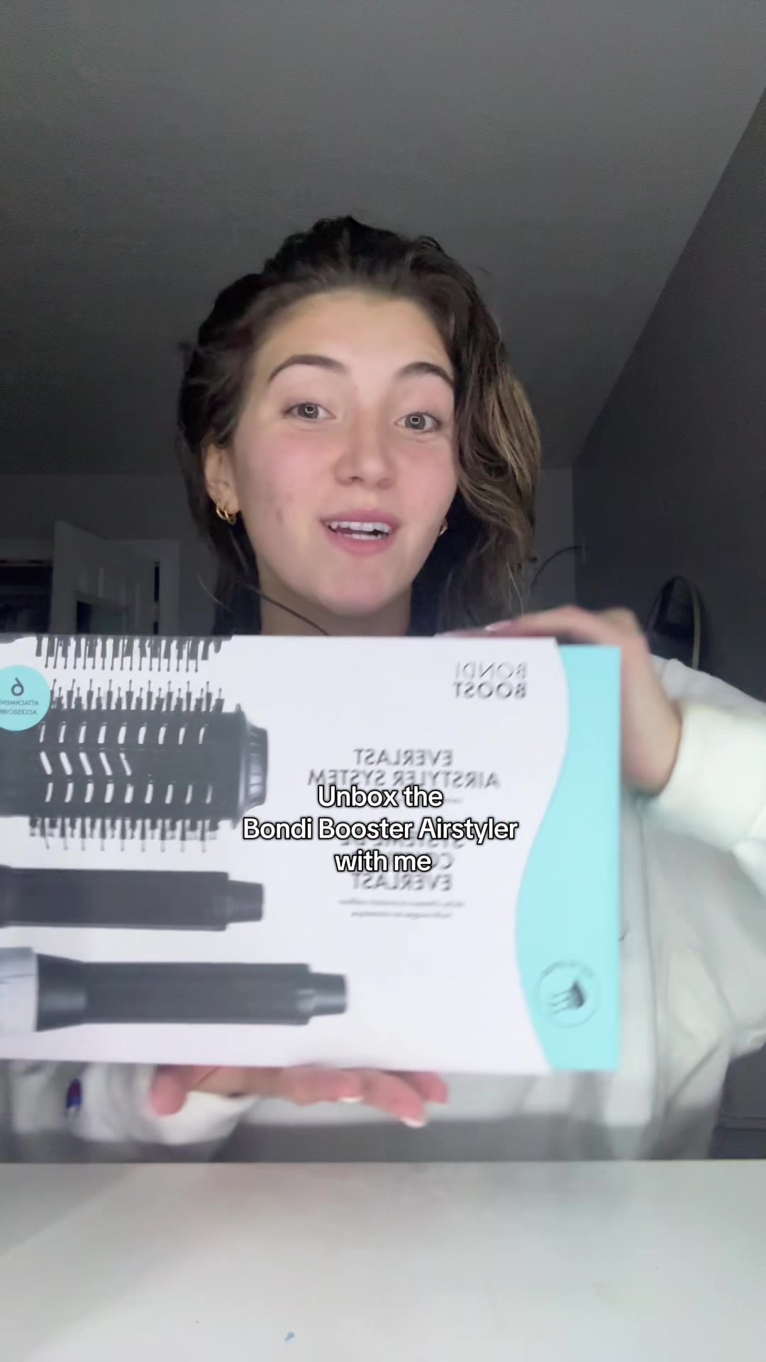 TikTok post by @emmyg1212 for BondiBoost. Caption reads: Unbox the @BondiBoost airstyler with me....