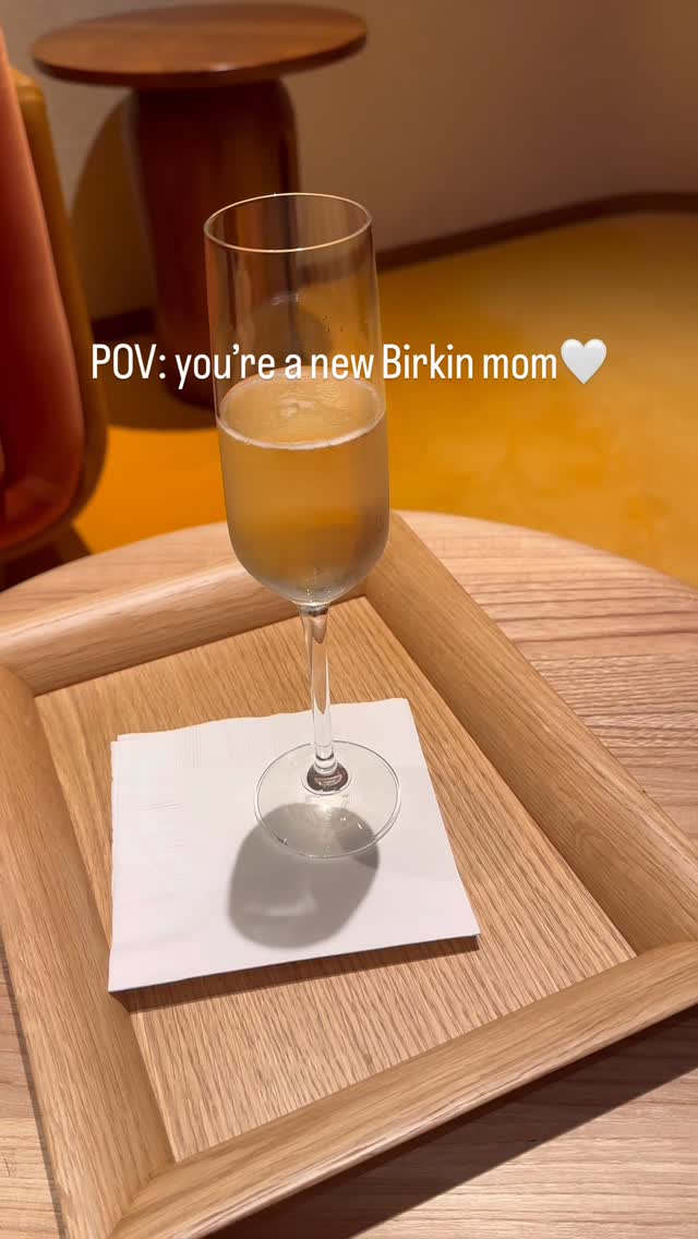 Instagram post by @hodaglamm for Hermès. Caption reads: I’m a mommy 🧡🍊
#birkinmomaesthetic #birkinbag....