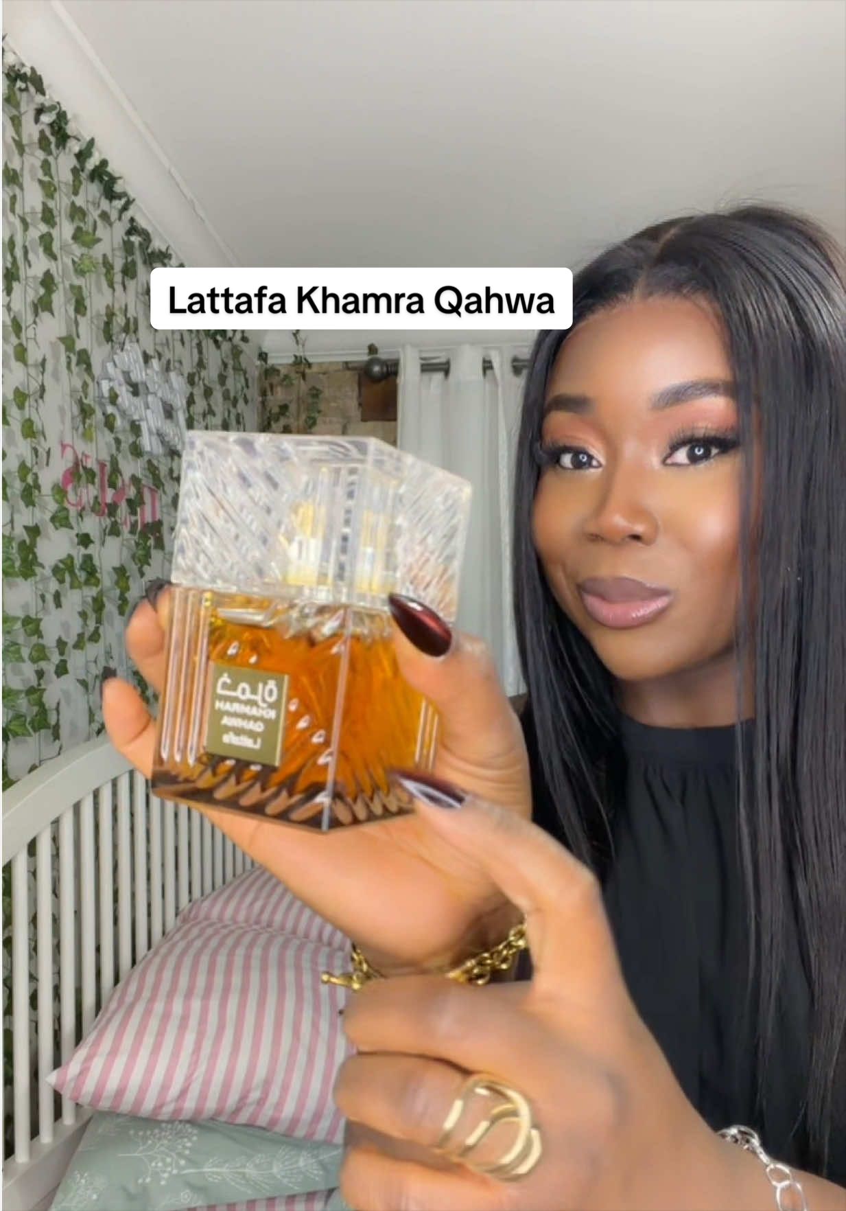TikTok post by @seyimii37 for OudLash. Caption reads: [...] Qahwa is a boss lady vibes perfume @Oudlash....