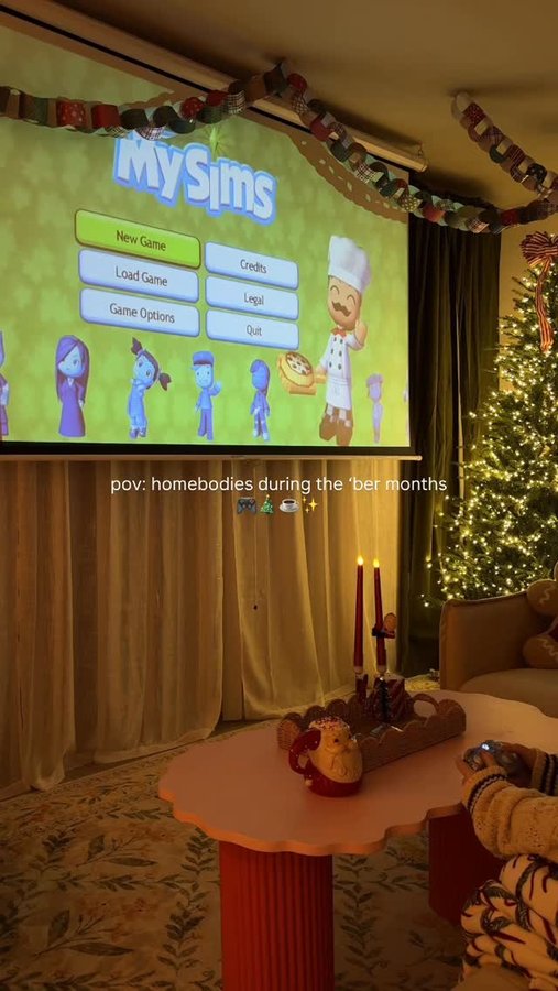 Instagram post by @theintrovertedition for The Sims. Caption reads: cozy season means staying in & cozying up with....