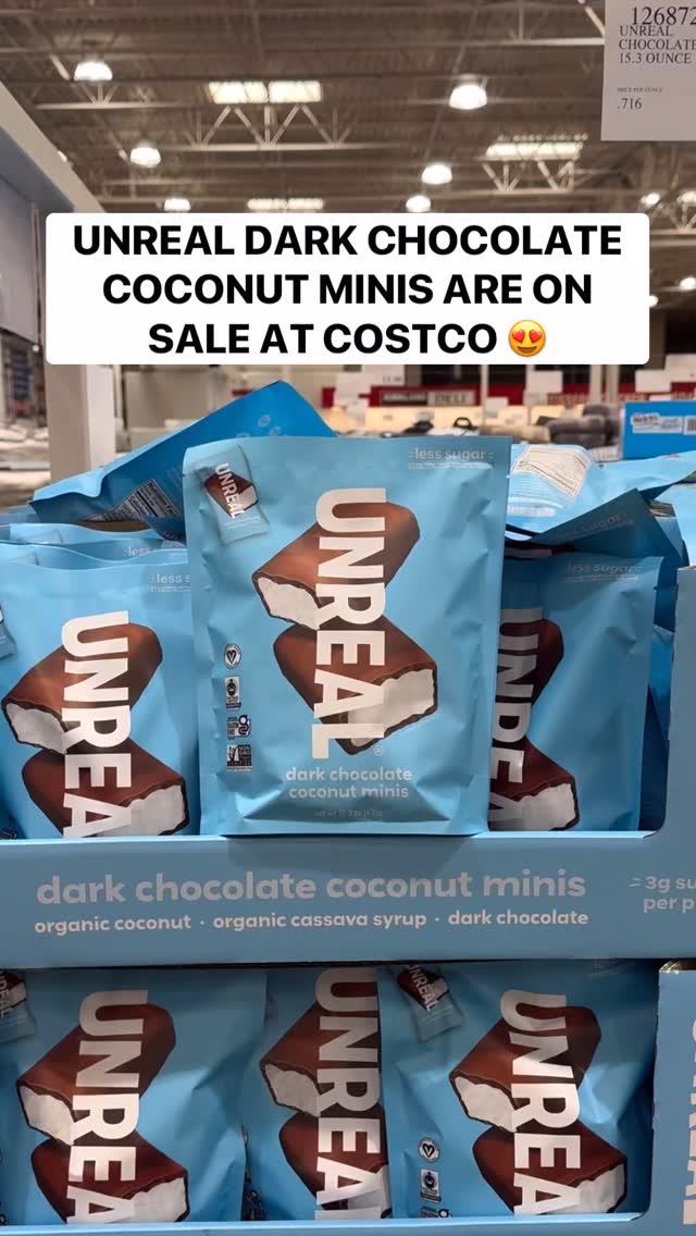 Instagram post by @costcobuys for UNREAL Snacks. Caption reads: 🎉 @unreal.snacks Dark Chocolate Coconut Minis are....