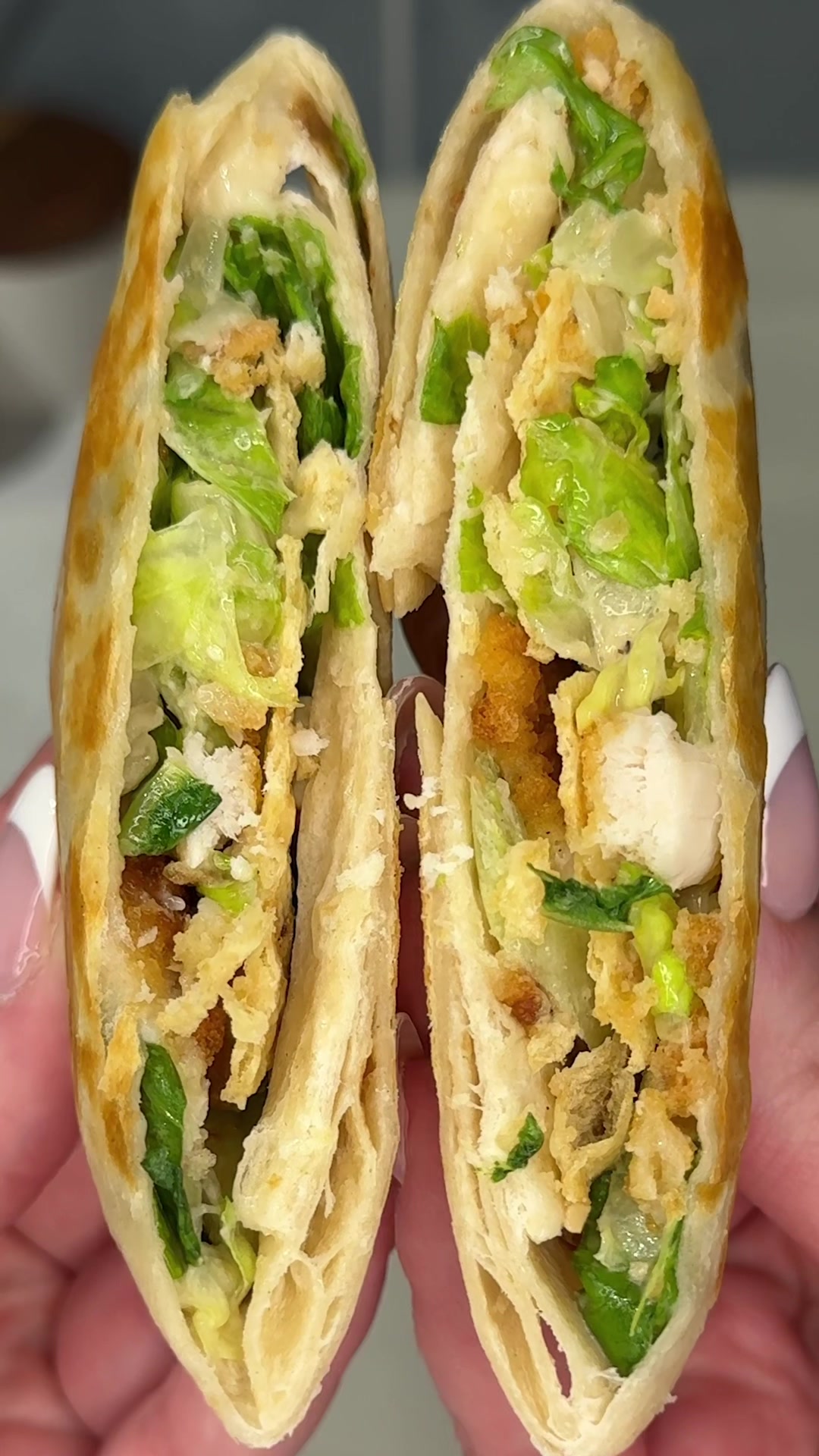 TikTok post by @ashleymarkleeats for Taylor Farms. Caption reads: the easiest mini chicken caesar salad crunch wraps....