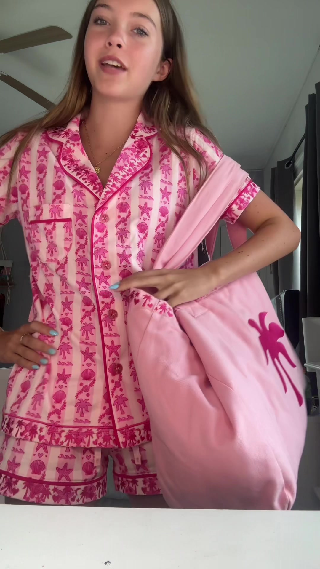 TikTok post by @.ella.elephant for PINK PALM PUFF. Caption reads: UNBOX MY @PINK PALM PUFF PAJAMAS WITH ME 💗🌴....