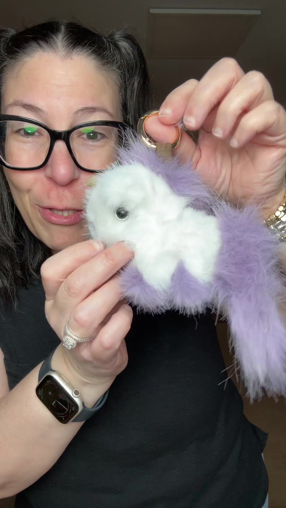 TikTok post by @sharisines for Bunnylulu. Caption reads: [...] adorable fluffy unicorn keychains from....