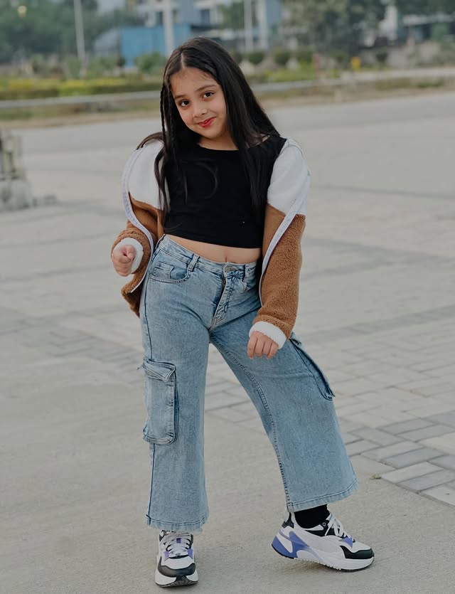 Instagram post by @prisha15.oficial for FirstCry. Caption reads: Her vibe is pretty and cute!🌸🤍🐻

#Collaboration....