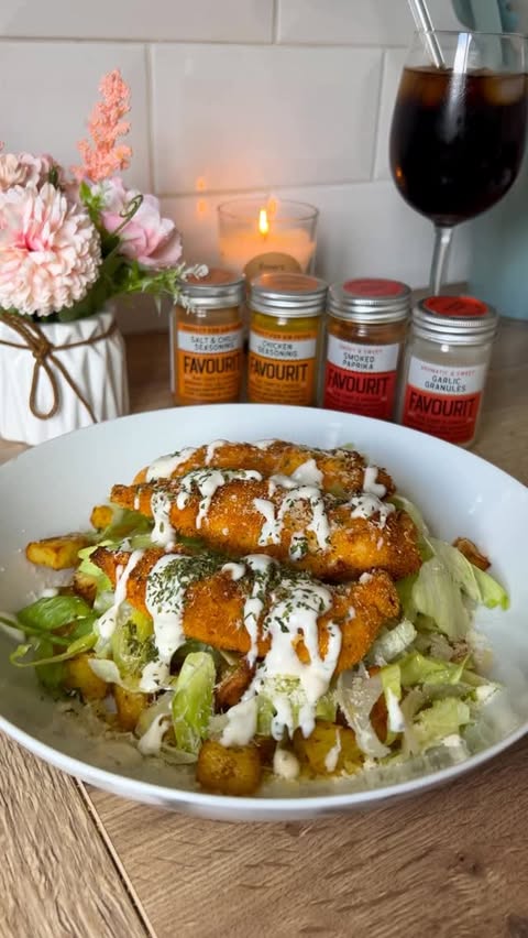 Instagram post by @eimers_eats for Favourit Foods Ltd. Caption reads: Crispy Chicken Caesar salad with Potato cubes....