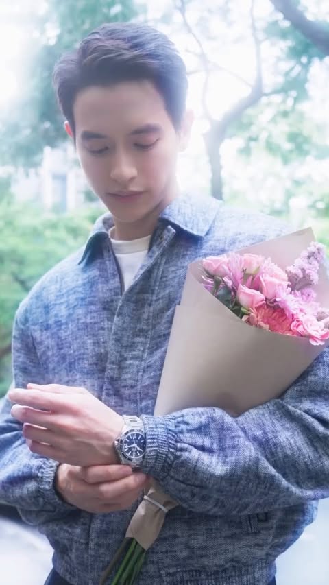 Instagram post by @jirayu_jj for OMEGA. Caption reads: [...] A moment. A story. Defined by time. @OMEGA....