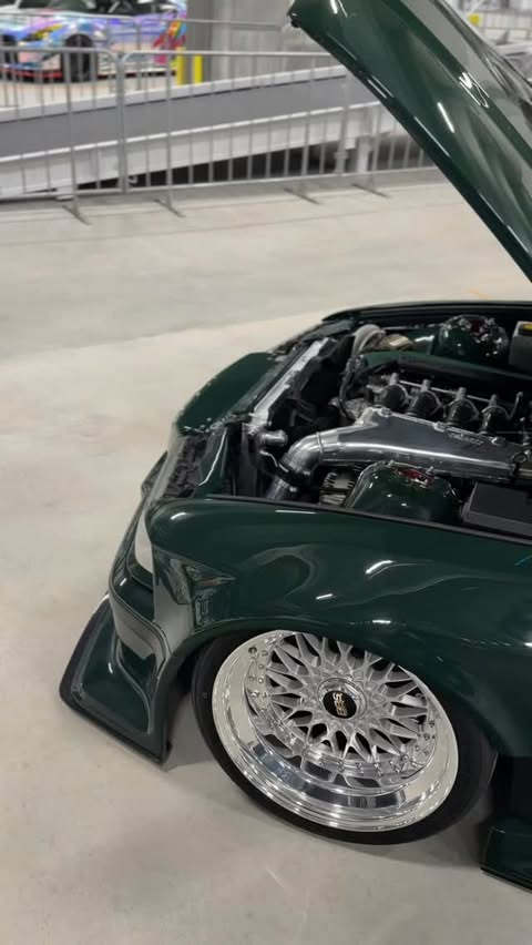 Instagram post by @air_lift_performance for Meguiar’s. Caption reads: E36 M3C TURBO🐌 British Racing Green sponsored by....