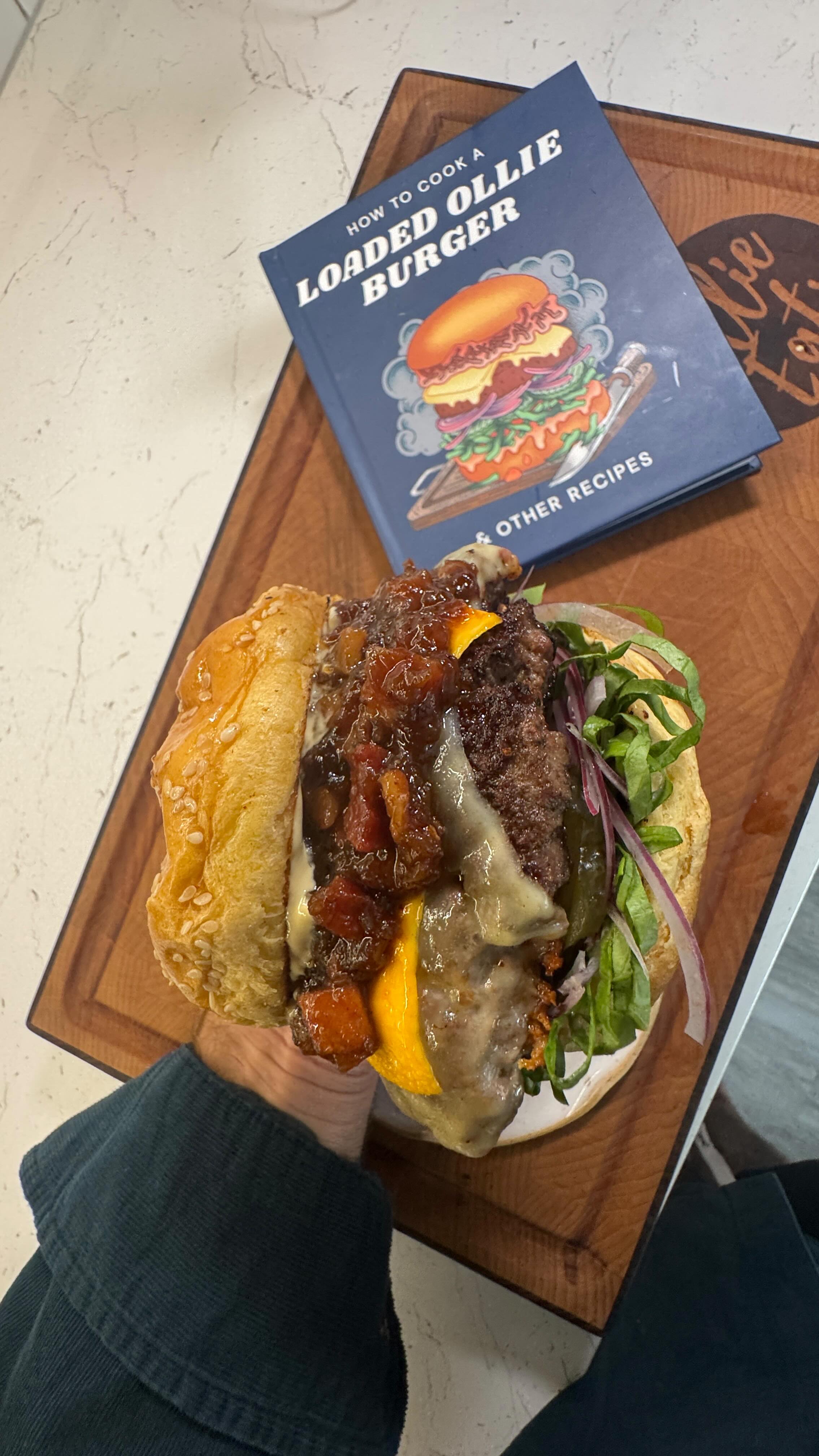 Instagram post by @ollie_eats for Wonderbly. Caption reads: Ad | I’ve got a burger named after me — and you....