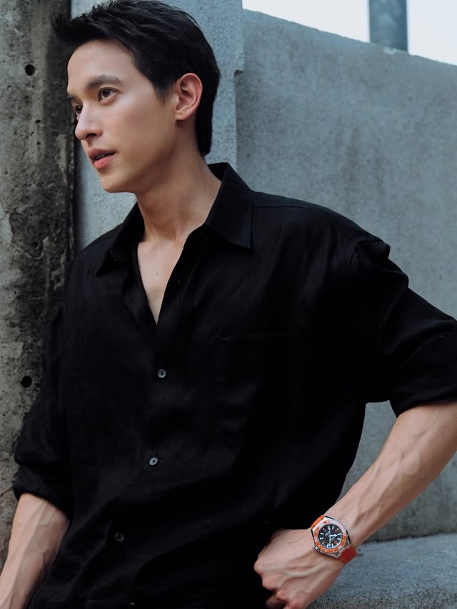 Instagram post by @jirayu_jj for OMEGA. Caption reads: Touch of Orange, a hint of power. @omega....