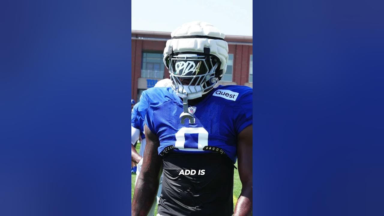 YouTube post by @Footballrs for SHOC. Caption reads: This Brian Burns Helmet Build is 😤😤😤.