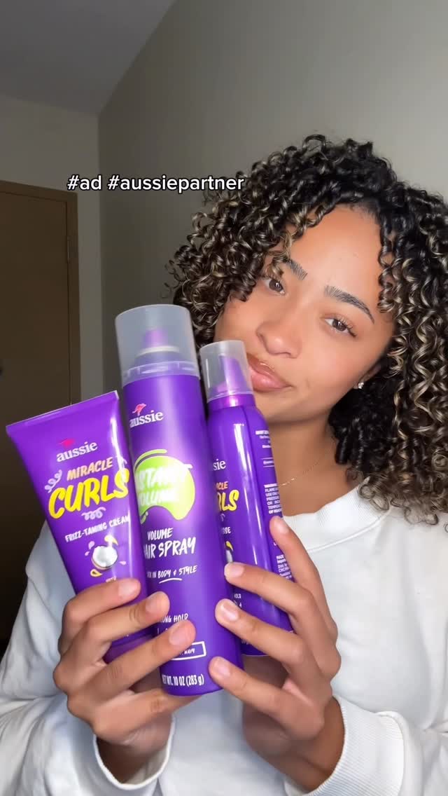 Instagram post by @isaa.javierr for Aussie Hair. Caption reads: #ad #aussiepartner 💜 quick 3-step routine for....