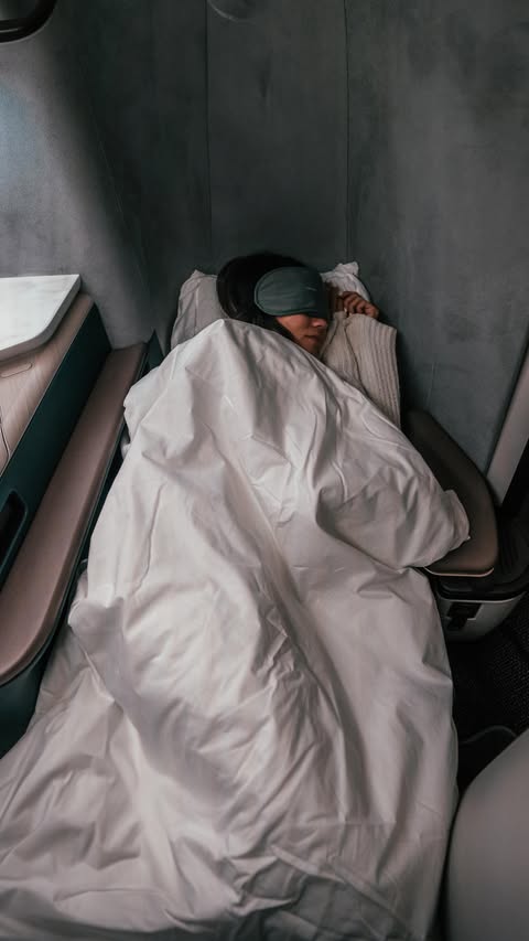 Instagram post by @bucketlistbums for Cathay Pacific. Caption reads: [...] the new Aria Suite Business class on....
