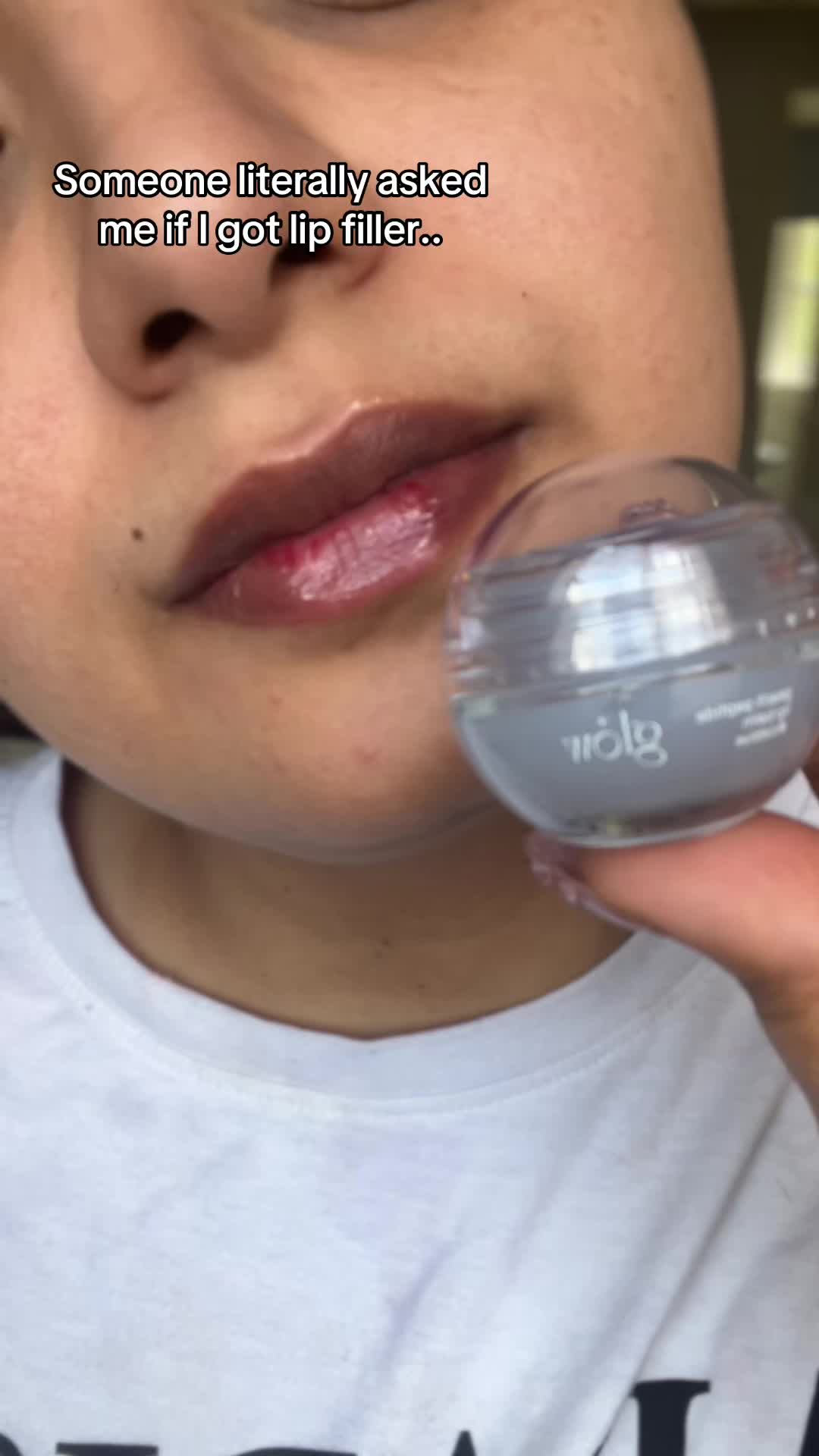 TikTok post by @elisellx for Glow Is Here. Caption reads: Glossy, hydrating, and actually feels good on the....