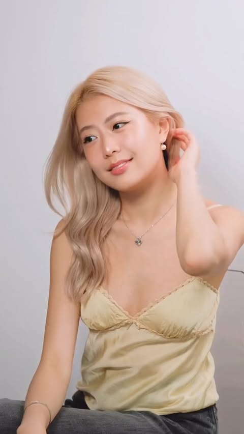 Instagram post by @capyhailey for Hourglass Cosmetics. Caption reads: the holiday glow hits different when the brand’s....