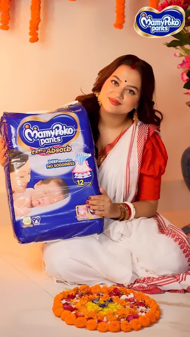 Instagram post by @the_ahona_dutta_official for MamyPoko. Caption reads: First Pujo with her in my arms, countless memories....