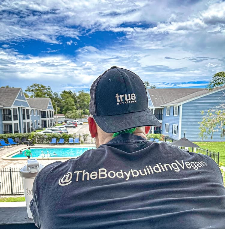 Instagram post by @thebodybuildingvegan for True Nutrition. Caption reads: [...] I signed my first contract ever with....