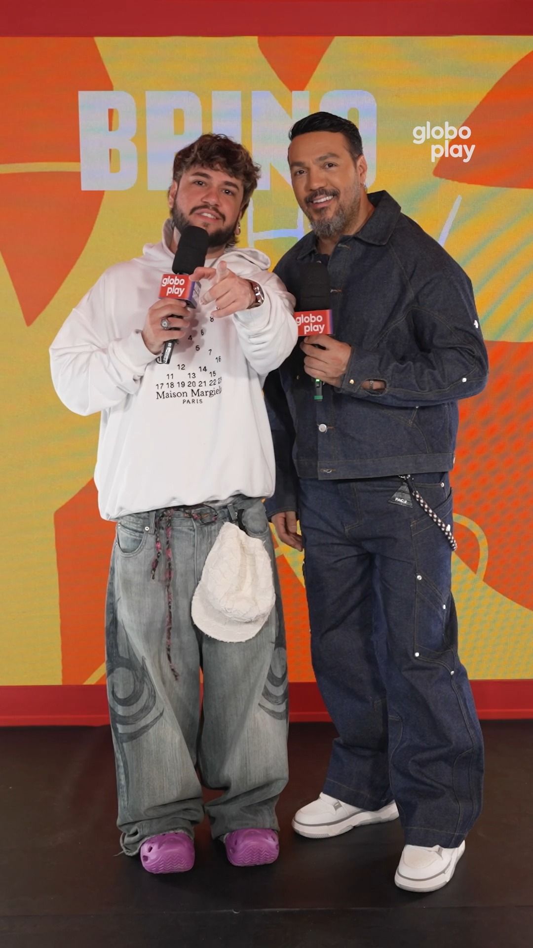 Instagram post by @belo for Globoplay. Caption reads: O Brino chamando o Belo de feio 🤭 #BrinoShow....