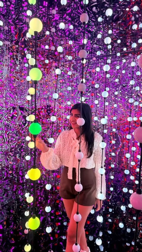 Instagram post by @dxb_heer for Fever. Caption reads: Experience pure joy at Dopamine Land ✨🌈 Lights,....