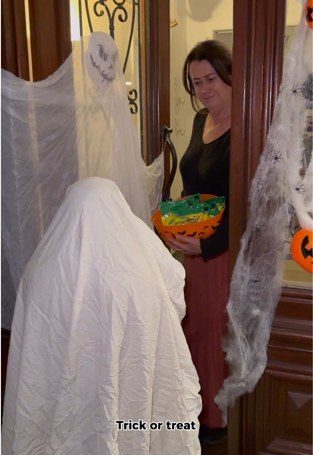 TikTok post by @adelesamus for Sour Patch Kids. Caption reads: 👻 Never too old for Trick or Treating… especially....