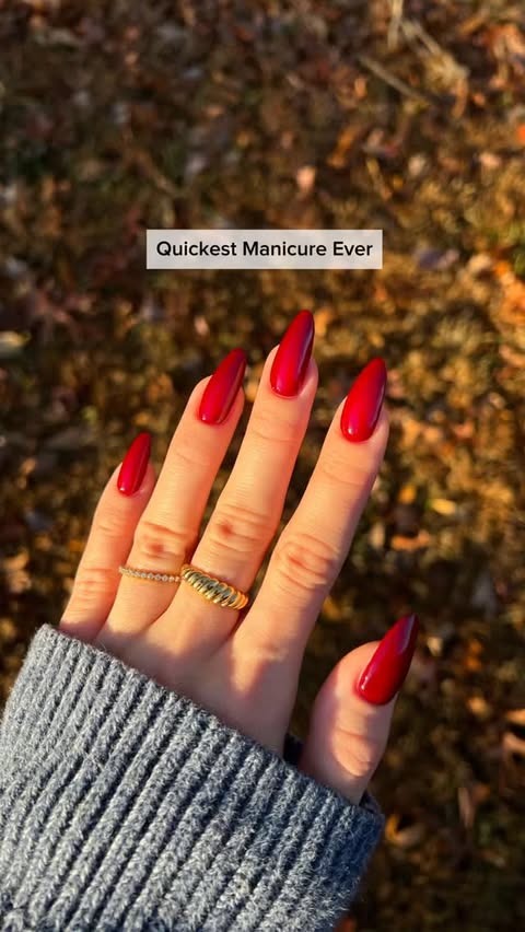 Instagram post by @nailsbysmf for Static Nails. Caption reads: The perfect glossy red for the holiday season.....
