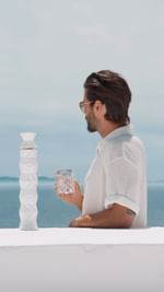 Instagram post by @yiorgoskaravas_official for Belvedere Vodka. Caption reads: Elegance distilled. Cheers to the finest things in....