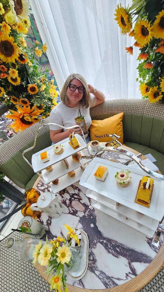 Instagram post by @harmonille for Veuve Clicquot. Caption reads: ✨ Sunflowers, Champagne & Mother–Daughter Moments....