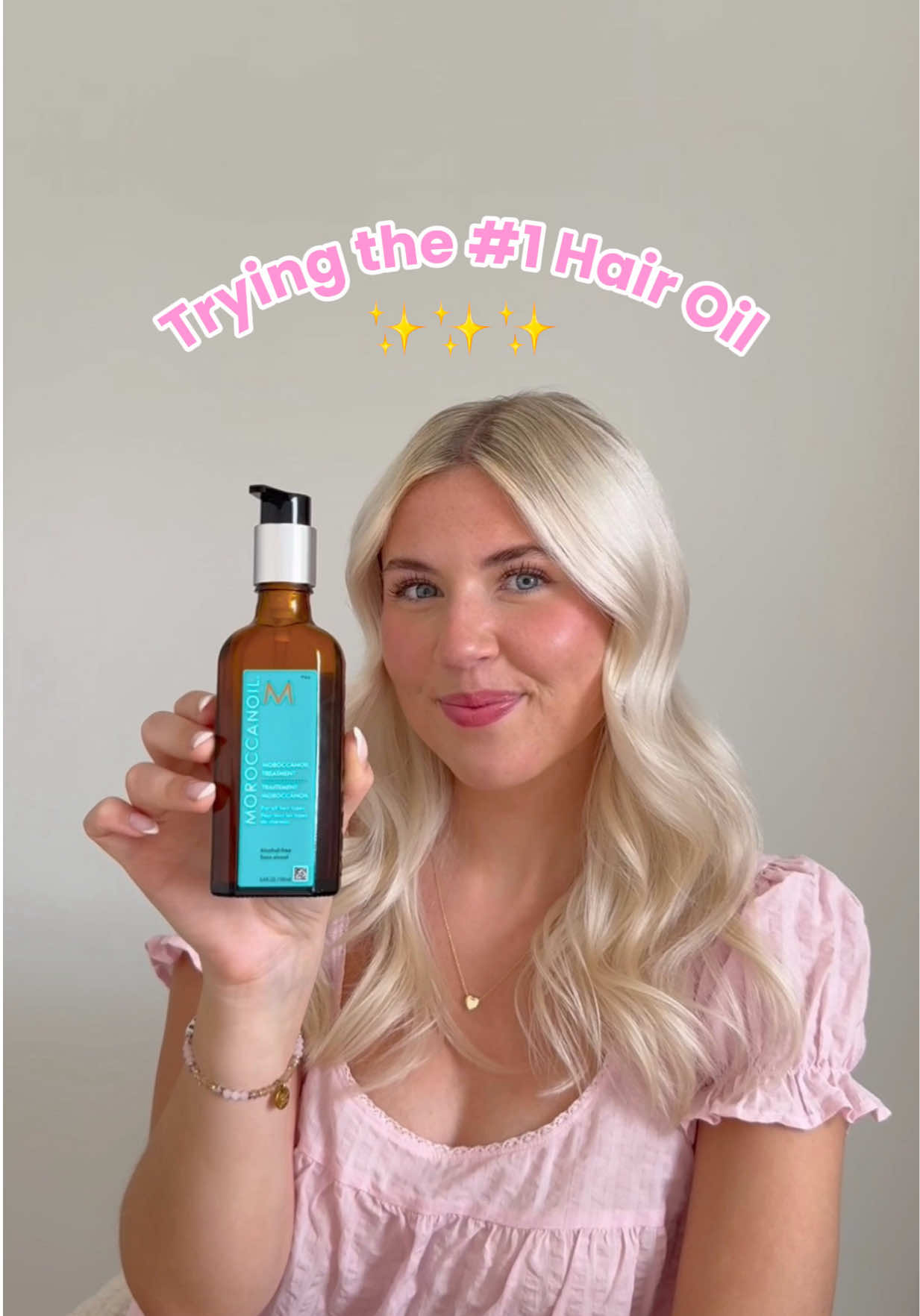 TikTok post by @taylor_pfeffer for Moroccanoil. Caption reads: [...] Hair Oil 👀✨🫣 This is the @Moroccanoil....