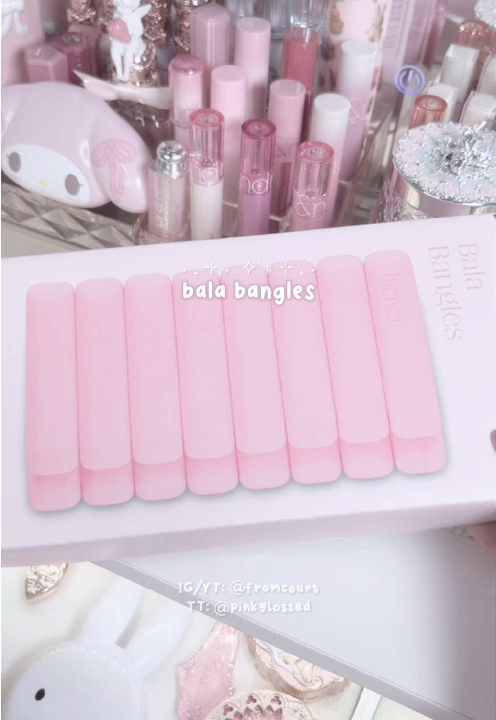 TikTok post by @pinkglossed for Bala. Caption reads: [...] pink weighted workout bangles from @BALA US....