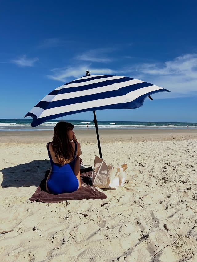 Instagram post by @courtneyadamo for BLUNT Umbrellas. Caption reads: We’ve been fans of the @bluntumbrellas for many....