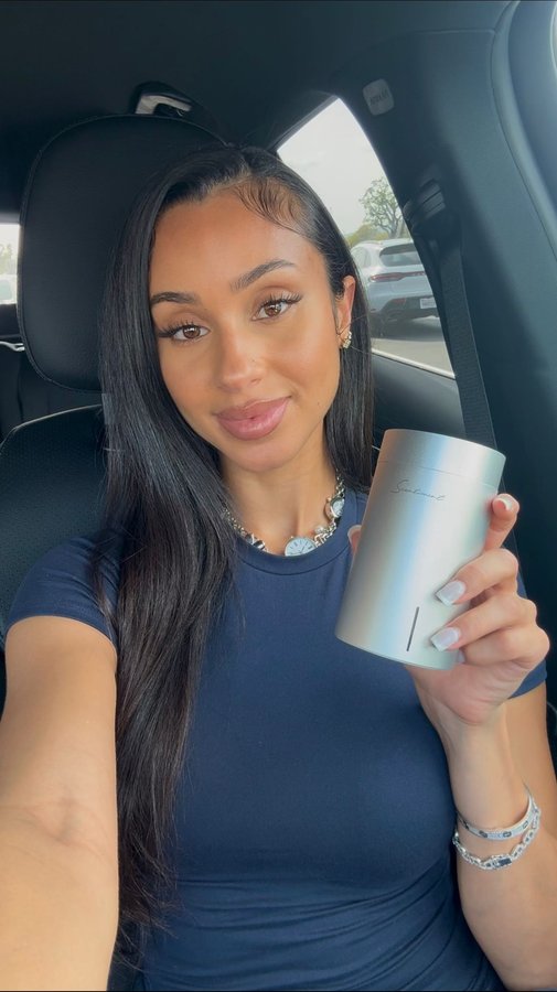 Instagram post by @jasmine.raee for Scentiment. Caption reads: @scentiment my car smells like a 5-star hotel....