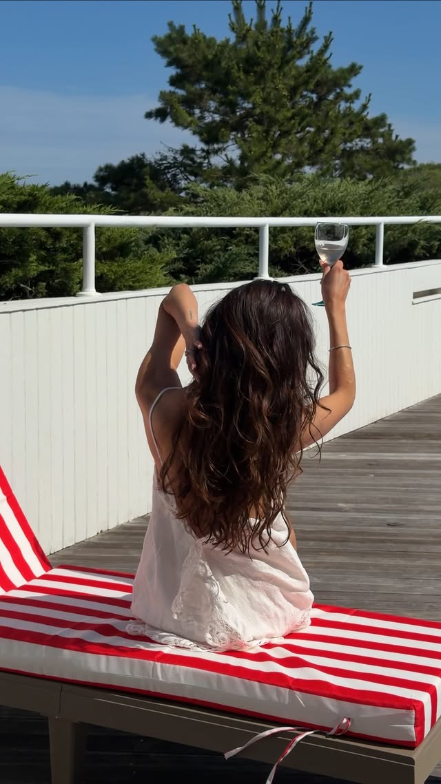 Instagram post by @jourdansloanechildress for OUAI. Caption reads: [...] summer hair routine in one bottle. @theouai....
