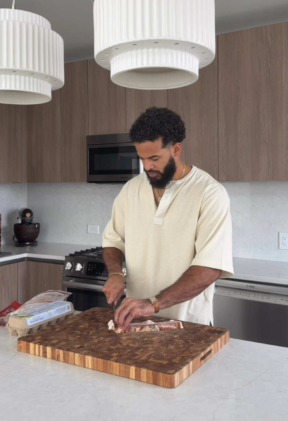 TikTok post by @desmondthechef for H&M. Caption reads: Breakfast & school fits with @H&M #AD.