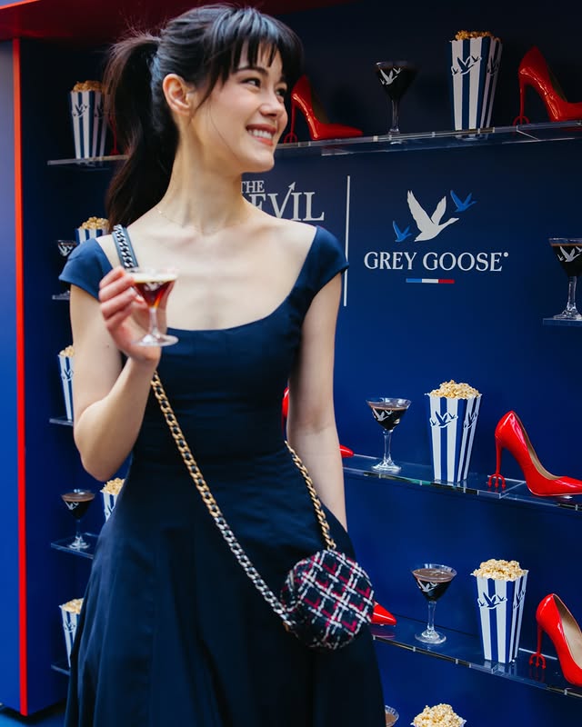 Instagram post by @alykima_ for GREY GOOSE Vodka. Caption reads: Miranda’s new assistant spotted picking up her....