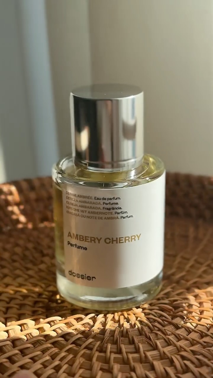 Instagram post by @momandkidlife for Dossier. Caption reads: 🍒✨ The scent that stops time…
Say hello to Ambery....