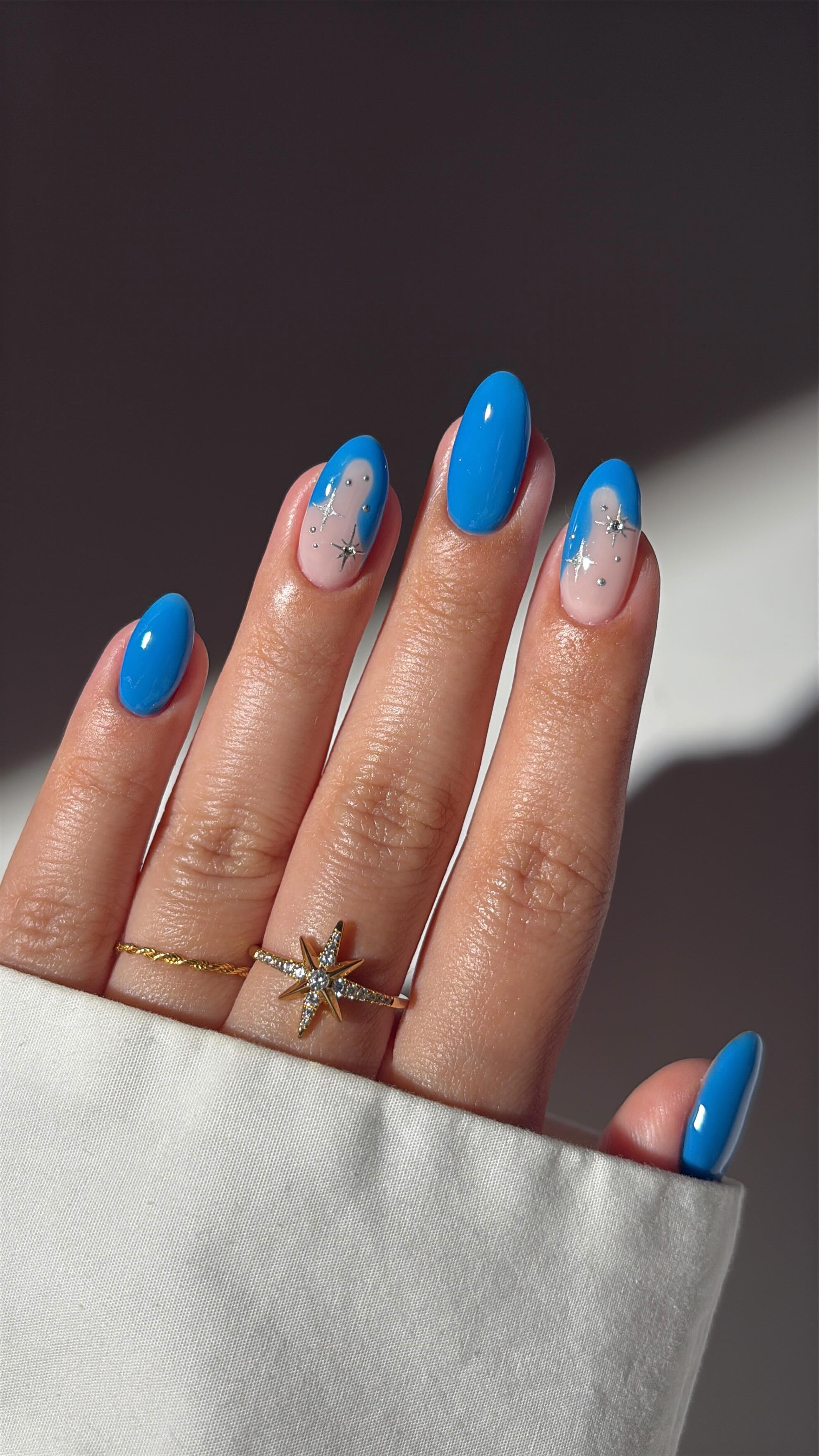Instagram post by an influencer for Kiara Sky Nails. Caption reads: ad • starry blue nails on @kiaraskynails new....