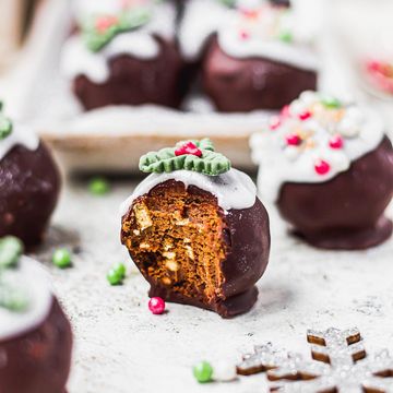 Instagram post by @nourishing.amy for THRIVE Magazine. Caption reads: Christmas Pudding Protein Chocolate Truffles....