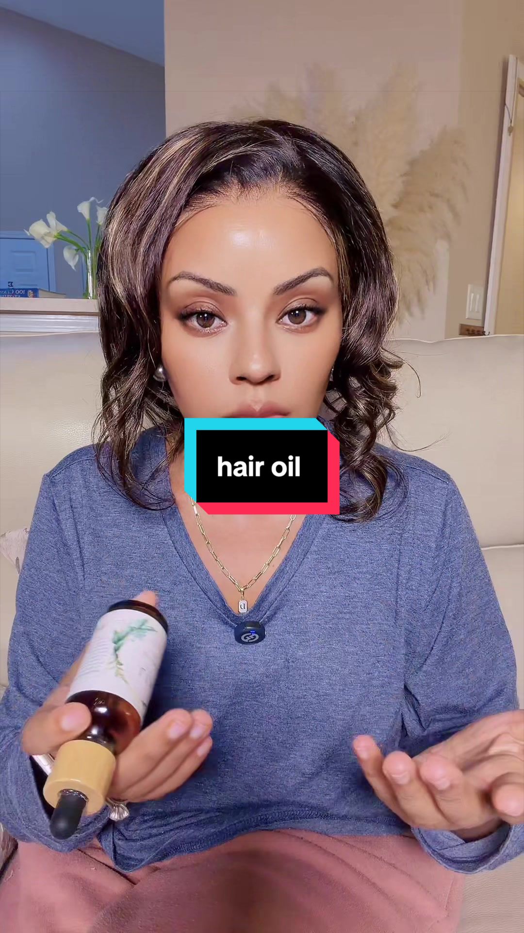 TikTok post by @hanna.robinson2 for LIA Organics. Caption reads: LIA Organics Hair Growth Oil 🌿 A nourishing oil....