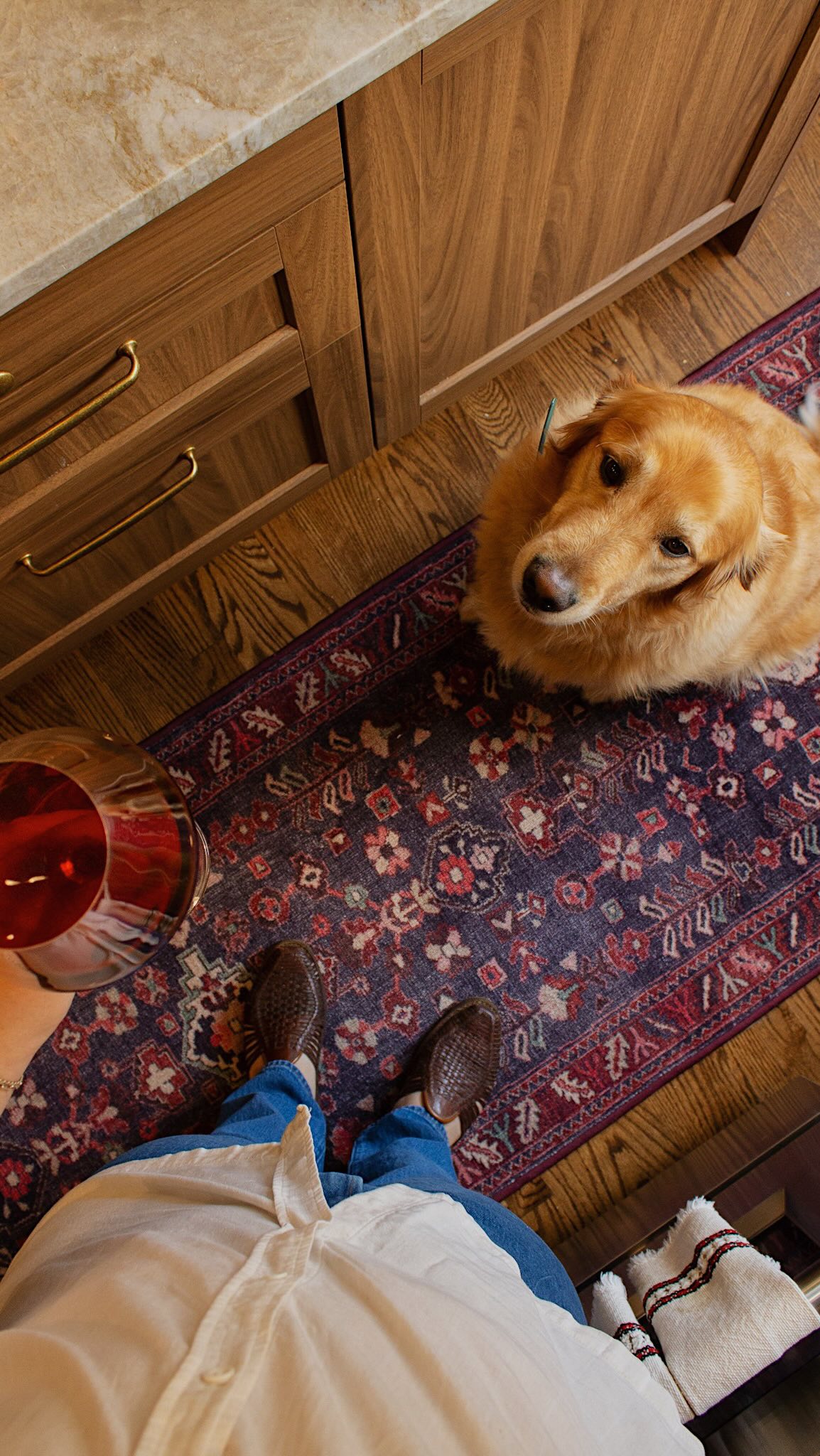 Instagram post by @homewithid for Ruggable. Caption reads: Hosting season is here, and our kitchen has never....