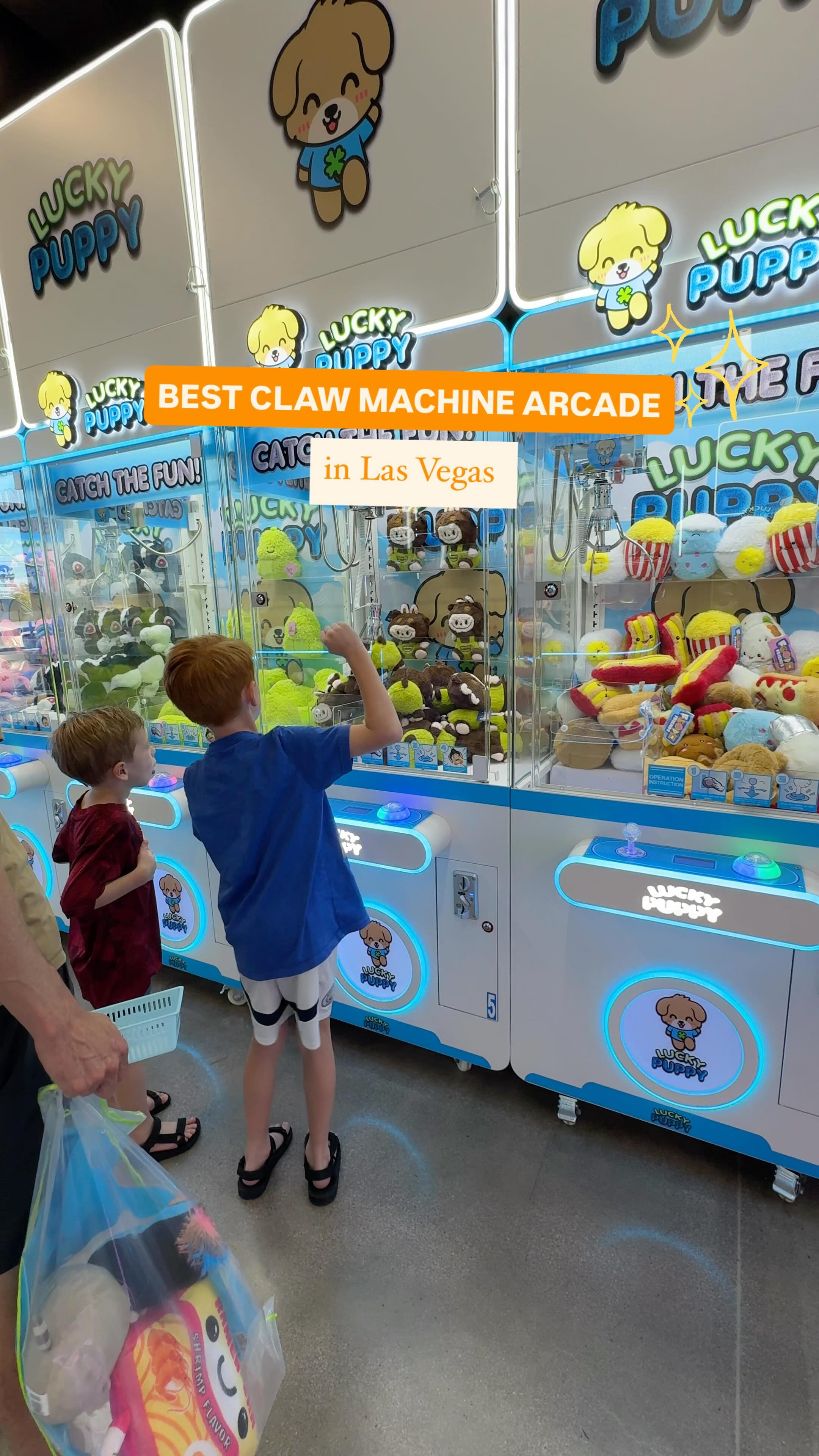 Instagram post by @outandaboutlasvegas for Groupon. Caption reads: ✨LUCKY PUPPY CLAW MACHINE ARCADE ON GROUPON ✨....