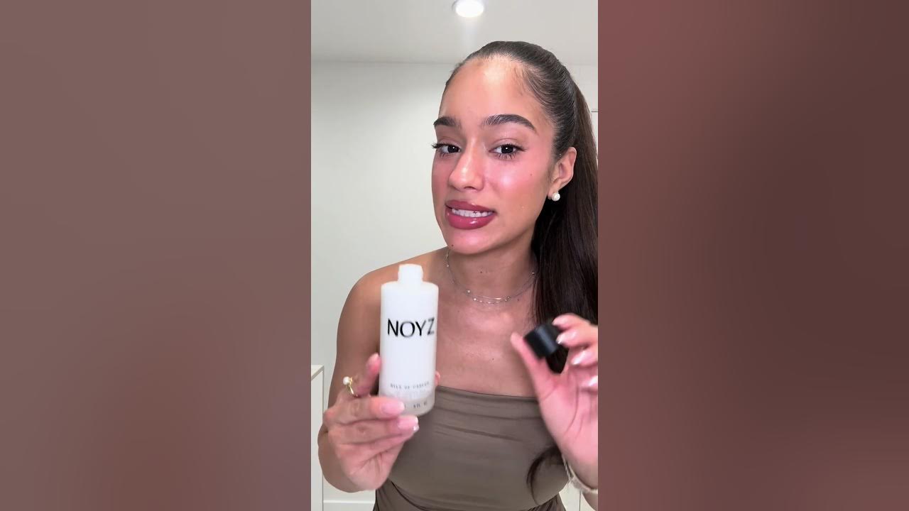 YouTube post by @LalaBaptiste for NOYZ. Caption reads: [...] (my man is obsessed with this scent 🤭)....
