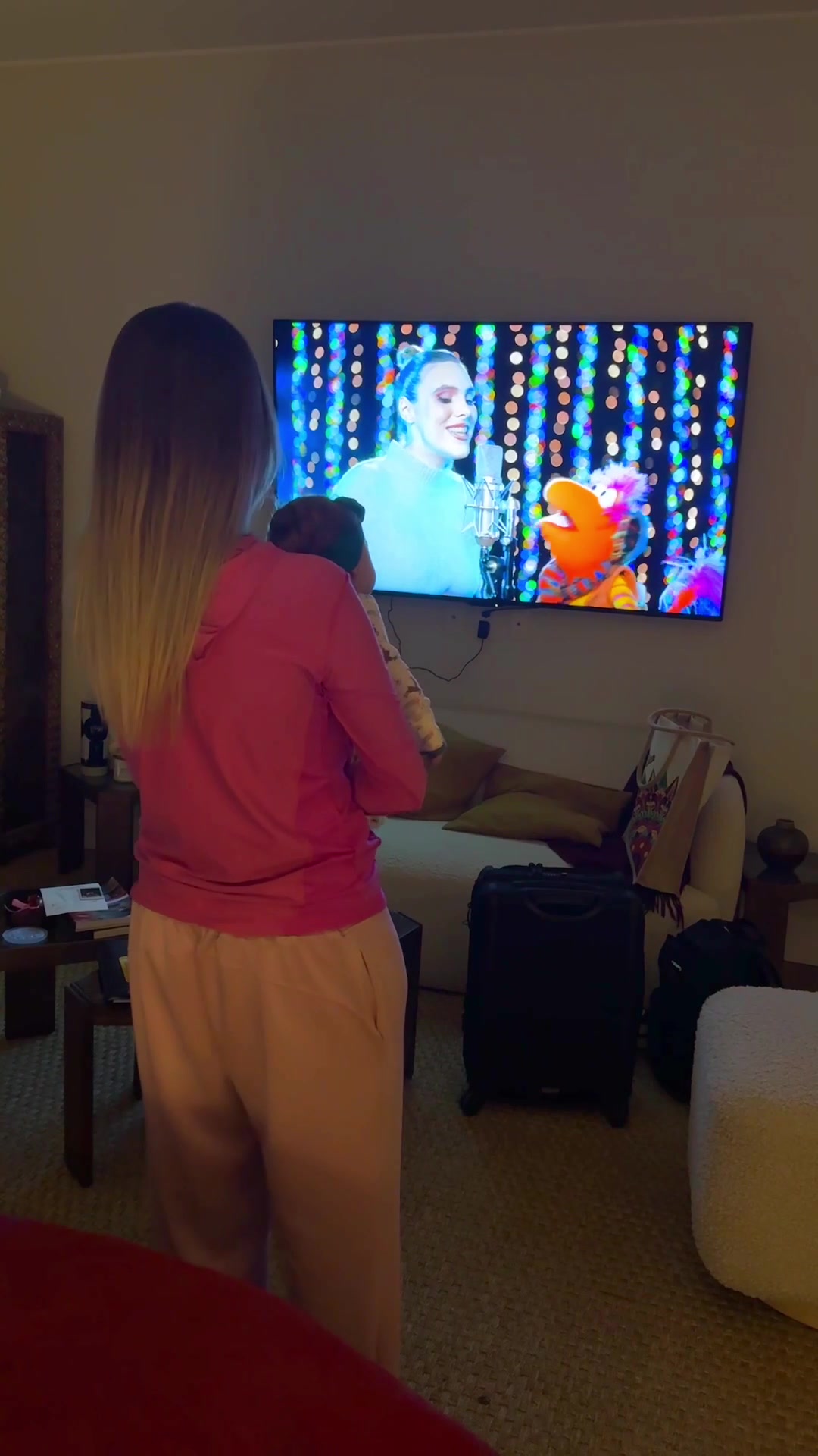 TikTok post by @lelepons for Apple TV. Caption reads: Eloisa watching mommy in The First Snow of Fraggle....