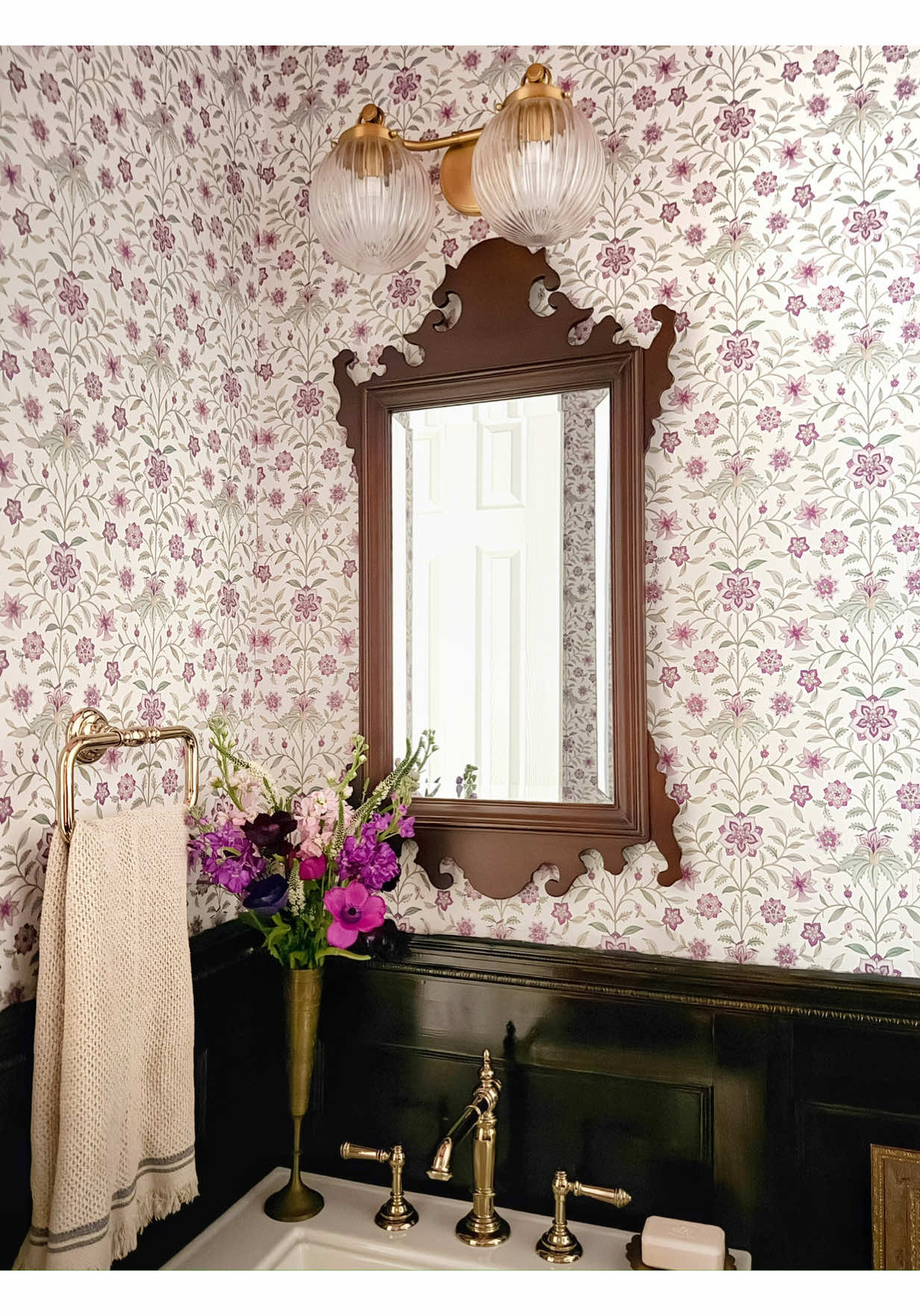 TikTok post by @penniesforafortune for KOHLER. Caption reads: This little powder bath was the very first room in....