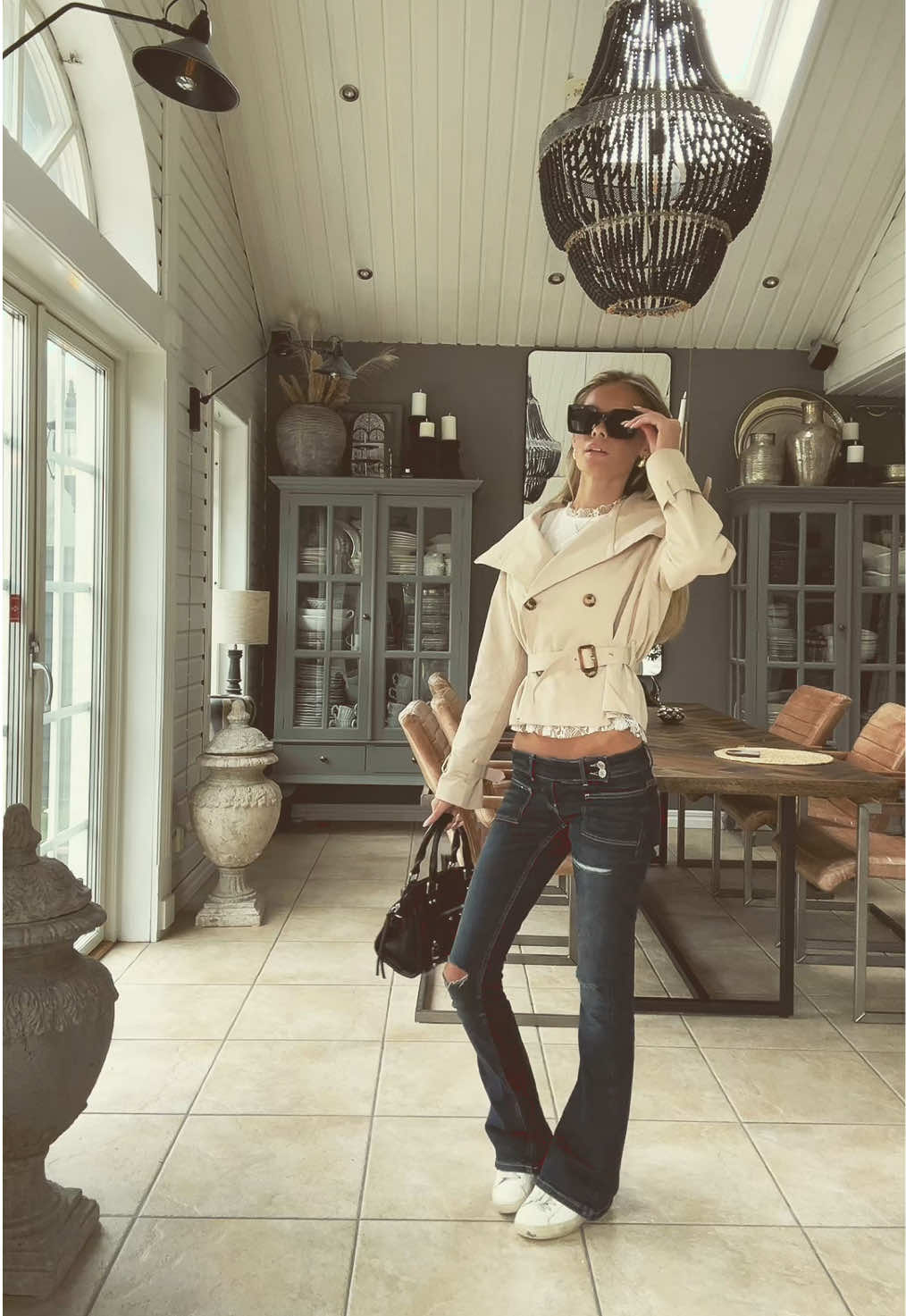 TikTok post by @vilmasoderberg for Meet Me There. Caption reads: 🤍🤍🤍blus och trenchcoat från @meet me there !!!.