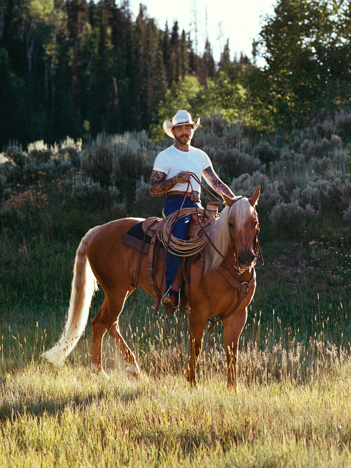 Instagram post by @postmalone for SKIMS. Caption reads: on the ranch with @skims #skimspartner.