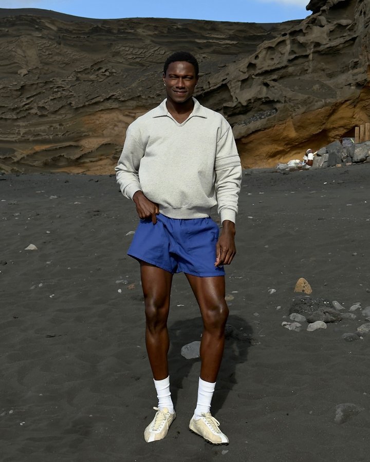 Instagram post by @sadiqdesh for FARFETCH. Caption reads: somewhere in the sun with @farfetch and some....